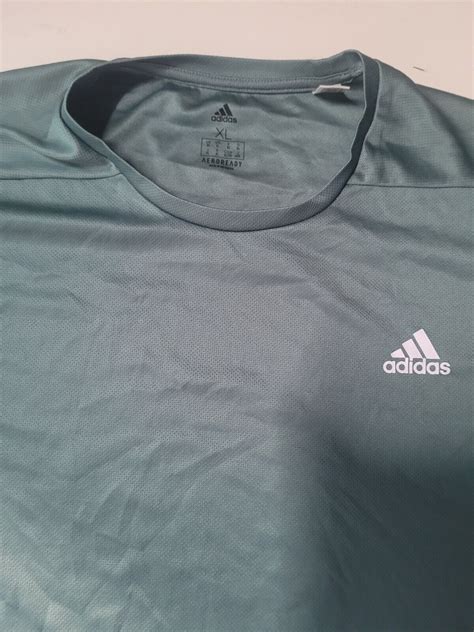 adidas grünes t-shirt mit seitlicher zierbahn|grüne Shirts für Damen .